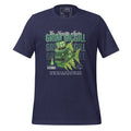 The Naughty Angler™ heather midnight navy unisex T-shirt featuring the “Grim McGill” front design with a finely detailed angler fish illustration, a St. Patrick’s Day theme, a clover inside a light-bulb-style lure, and subtle “Grim McGill” text in the background