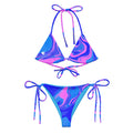 Women’s ocean pink print recycled string bikini top with pink and blue fluid art design and white silhouette on the front left side by The Naughty Angler™