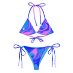 Women’s ocean pink print recycled string bikini top with pink and blue fluid art design and white silhouette on the front left side by The Naughty Angler™