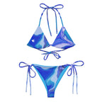 Women’s ocean print recycled string bikini top with fluid art design and white silhouette on the front left side by The Naughty Angler™