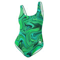 Front view of women’s sea green one-piece swimsuit with green fluid art design and white circular The Naughty Angler™ logo
