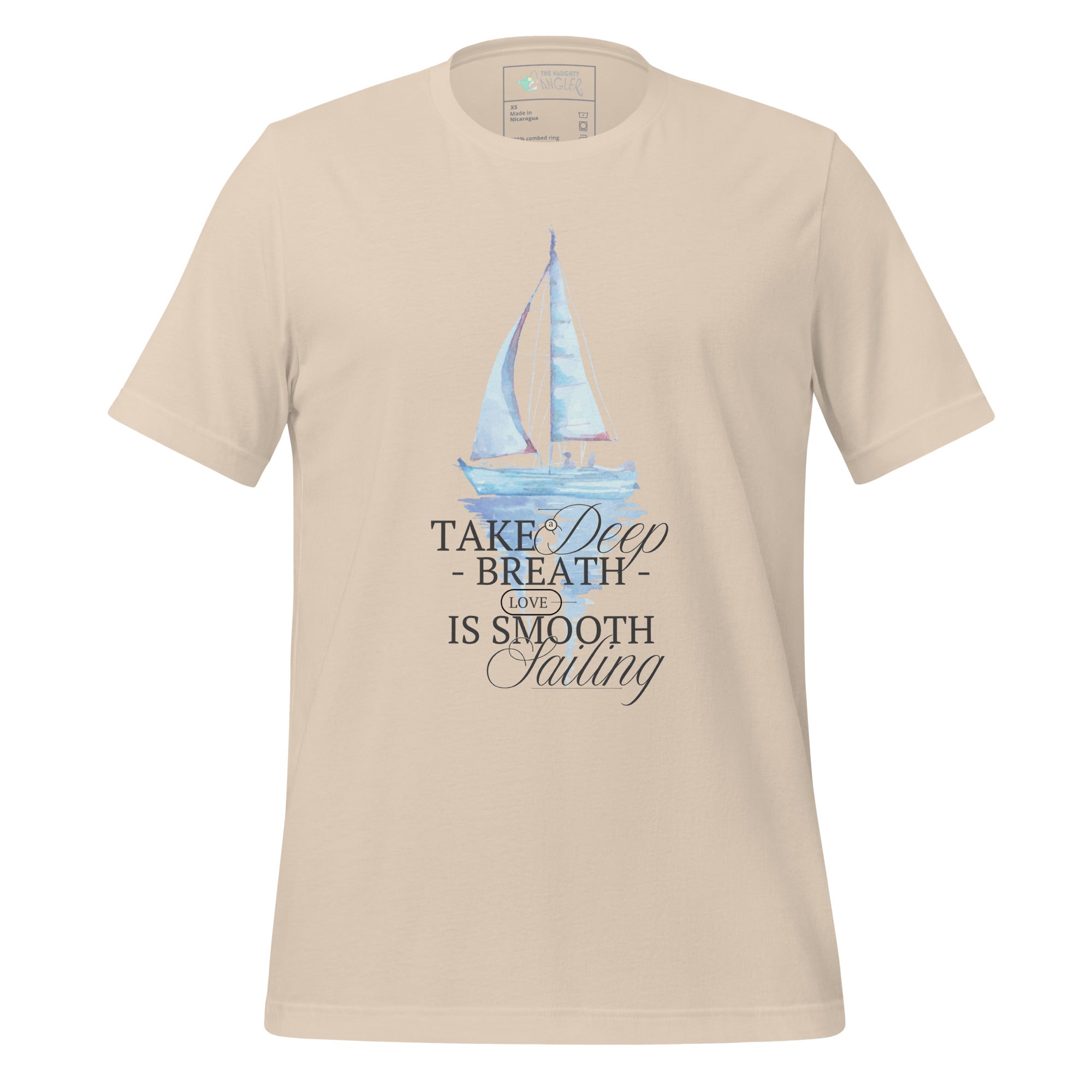 Front view of unisex soft cream T-shirt with elegant wording “Take a Deep Breath Love Is Smooth Sailing” and a pastel sailboat illustration by The Naughty Angler™
